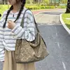 Bolsa de nylon com estampa de leopardo retrô de nicho para mulheres, novo modelo 2026, grande capacidade, moderna e versátil, adequada para o trabalho, pode ser usada como bolsa de ombro ou transversal.