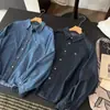 Nueva camisa de mezclilla de manga larga a la moda estilo coreano para mujer 2026, corte holgado, efecto adelgazante, top versátil, prenda exterior casual