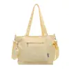 Bolso de lona de color liso transfronterizo nuevo, bolso de hombro de gran capacidad, bolso tote versátil para estudiantes, bolso de mano, bolso cruzado