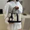 Bolsa de Jardín de Lona de Gama Alta 2025 Nueva Bolso de Mujer de Color Contrastante Bolso de Hombro Casual para Viajar Bolso Tote Estilo Occidental