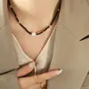 Collar de cuentas de vidrio negro con personalidad y temperamento de moda, colgante de perlas de agua dulce, joyería sexy, diseño original de nicho.