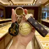 Conta de Água Tesouro Dourado Deus da Riqueza Moeda de Ouro Pingente de Celular Chaveiro de Bolsa Tráfego da Loja Fonte Ao Vivo Atacado