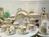 Juego de vajilla de porcelana de hueso estilo retro europeo transfronterizo, 58 piezas, carro de caballos dorado, juego de café, plato, tazón, cuchara, plato, juego para el hogar
