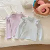 Camiseta básica de manga larga con volantes para niña, nueva para primavera y otoño, cuello medio alto, color liso, top cálido para bebé, ropa de algodón engrosada para niños
