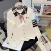 Broche de lazo, bordado de cachorro, suéter de punto de manga larga para solapa, nuevo jersey de estilo universitario otoño e invierno 2026 para mujer
