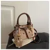 Bolso cubo de moda de lunares transfronterizo, diseño de nicho, bolso de hombro cruzado con hebilla de cinturón, bolso de mano vintage versátil para ir al trabajo