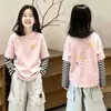 Camiseta Feminina Manga Longa Falsa Duas Peças Primavera e Outono 2026 Novo Estilo Infantil Algodão Puro Menina Moda Outono Roupa Base Camiseta