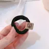 Cuerda para el pelo con forma de cabeza de oso, de goma elástica, para mujer, estilo nuevo, con forma de anillo, duradera, con forma de bola y cubierta de cuero.