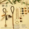 Kit de material DIY para fazer um móbile de casca de fruta, um sino pendurado de cura, com frutas pretas indonésias, estramônio, lírio d'água e rotim