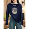 La camiseta de manga larga de algodón puro más vendida de este año para mujer, una prenda elegante y versátil perfecta para usar en capas en otoño, con un diseño único y moderno.