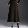 Saia de Lã Elegante Linha A Feminina 2026 Outono/Inverno Nova Cintura Alta Versátil Longa Elegante Cobre o Quadril Bainha Larga