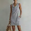 Nuevo vestido corto de mujer de estilo europeo y americano, éxito transfronterizo en TikTok, color liso, drapeado, sin mangas, cuello fruncido, con bolsillos