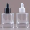 Venta al por mayor del fabricante Botella gotero de 20 ml 30 m Botella dispensadora de líquido original Empaque médico transparente Botella de vidrio de hombro plano para aceite esencial