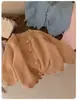 Otoño Invierno 2026 Nuevo Estilo para Niñas Estilo Coreano Cárdigan de Punto Cuello Redondo Abrigo Holgado Elegante Venta al por Mayor Transfronteriza