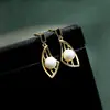 Nuevos pendientes de perlas con alas de pez para otoño e invierno 2023, accesorios para orejas de mujer, diseño nicho, alta gama, pendientes geométricos de diamante