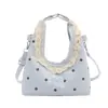 Bolso de lunares de nuevo temperamento 2026 elegante de verano para mujer de trabajo versión coreana bolso cruzado moderno bolso de mano simple versátil