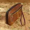 Bolso de Mano Retro de Cuero de Vaca Crazy Horse Transfronterizo para Hombre con Correa de Muñeca Piel Genuina Bolsa de Almacenamiento para Cables de Datos, Papelería Bluetooth