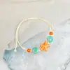 Jingdezhen Navidad Pulsera de Cuerda Trenzada de Cerámica Pulsera de Trébol de Cuatro Hojas Joyería Artística Hecha a Mano Venta al por Mayor Pulseras de Cerámica para Atracciones Turísticas