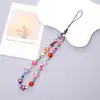 Cadena para teléfono de perlas estilo Chanel Colgante de flor pequeña Cordón para teléfono Funda para teléfono Accesorio con cuentas Cadena anticaídas para mujer