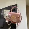 Bolso pequeño rosa a cuadros súper popular para mujer, nuevo bolso cruzado versátil de moda 2026, bolso cuadrado pequeño informal tipo caja estilo coreano