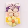 Acessórios de Cabelo Infantis Europeus e Americanos Conjunto de Faixa de Cabeça de Nylon Macio para Bebê Lindo Conjunto de Três Peças de Faixa de Cabeça Protetora de Porta para Bebê com Flor