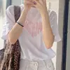 Camiseta Estampada Retro Coreana com Ombro Reto Feminina Top Verão 2026 Novo Tamanho Grande Solta Ins Algodão Puro Branco Manga Curta