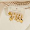 Aretes de acero de titanio chapados en oro para mujer, aretes de alta gama que no se desvanecen, aretes asimétricos vintage, aretes transfronterizos, aretes de estrellas