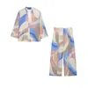 Venta al por mayor transfronteriza 2026 Moda casual europea y americana con ribete de encaje y estampado, conjunto de camisa de manga larga + pantalones para mujer D226540