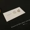Nuevos pendientes de amor asimétricos 2023, aguja de plata S925, diseño de nicho femenino, clip para oreja compacto de moda, venta al por mayor
