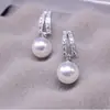 Brincos Elegantes de Pérola com Cravação de Diamantes Geométricos Curvos Coreanos 925 Luxo Acessível Design Versátil de Nicho Brincos de Alta Qualidade