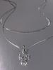 Collar Transfronterizo Europeo y Americano de Doble Capa con Cruz de Acero de Titanio Completamente Incrustada con Diamantes para Niñas Lujo Ligero Nicho Versátil No se Desvanece Cadena Plana de Hueso de Serpiente