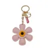 Colgante de Bolsa de Girasol de Dibujos Animados Venta Caliente Accesorios Miu Llavero de Cuero Funda de Teléfono de Girasol Decoración de Bolsa