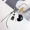 Nuevo Llavero Minimalista de Oso Estilo Coreano con Colgante de Corazón Negro para Bolsos y Mochilas al por Mayor