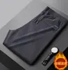 Pantalones Rectos Engrosados de Pana a Prueba de Frío para Hombre Otoño e Invierno Elásticos con Cordón Ajustable Ajustados Bolsillo Alto Cremallera Pantalones Largos