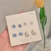 Golpea la cura de Azul ~ 2022 pequeño juego de pendientes de Margarita diseño de nicho pendiente de oreja pendientes estilo Ins para mujer