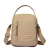 Bolso de hombro y cruzado para mujer de lona de nailon nuevo, bolso pequeño moderno y versátil, bolso para teléfono portátil multicapa, bolso de mano simple