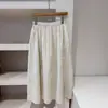 Adaptabilidad desde el Color Beige Diseño Suave, Falda de Retazos de Cintura Alta de Longitud Media Texturizada E018