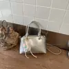 Bolsa de concha de diseño de nicho de comercio exterior 2026 Nuevo estilo de verano Bolso de hombro Versátil elegante Bolso cruzado de moda Bolso pequeño de moda