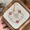Exquisito Pulsera Extraíble con Incrustaciones de Diamantes, Brillante Imitación de Concha Rosa Natural, Trébol de Cuatro Hojas Hueco de la Suerte para Mujeres, Joyería de Mano de Lujo Ligero de Nicho