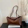 Coleção Outono 2026: Bolsa de ombro lisa, leve e estilosa para mulheres, perfeita para o trajeto diário.; atacado de bolsas tote femininas