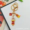 Llavero Colgante Año Nuevo 2026 Metal Zodiaco León Dorado Petardo Despertar Bolsa de la Fortuna Colgante Evento Pequeño Regalo