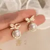 Brincos de Pérola em Forma de Laço Femininos Exquisitos Moda Luxo Leve Brincos de Trabalho Brincos com Sentido de Design Avançado Brincos com Zircônia