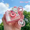 Llavero de Cámara Instantánea Gato KT Temporada de Flores de Cerezo Familia Sanrio Divertido Juguete para Niños Estudiantes Colgante para Bolsa