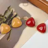 Moda Europea y Americana Transfronteriza Retro Simple y Elegante Versátil Pendientes Triangulares de Resina con un Toque Francés de Alta Gama y Lujo Ligero