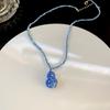 Pendientes y collar de cristal de color calabaza pequeña con un toque de diamantes de alta calidad, adecuados para un temperamento de nicho, joyería nueva súper llamativa