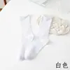 Calcetines de tubo medio blancos de primavera y otoño de la marea para niños, calcetines de algodón de color liso con términos verticales de verano para niñas jk, negros rizados apilados