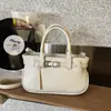 Diseño de Nicho Transfronterizo Primavera 2026 Nuevo Estilo Simple Alta Gama Textura Bolso de Mujer Hombro Único Axila Cruzado Bolso Cubo