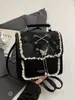 Bolso de Moda Minimalista de Nicho Primavera 2026, Bolso Cruzado Texturizado con Lazo Dulce Estilo Universitario a la Moda para Mujer