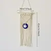 Tapeçaria de parede personalizada, tecida à mão, com desenho de olhos azuis e franjas, ideal para decoração de quarto infantil.