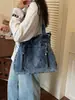 Bolsa de mezclilla tipo tote para mujer, modelo nuevo 2026, gran capacidad, versátil para ir al trabajo, bolsa cruzada, bolso grande para que los estudiantes lo usen en clase